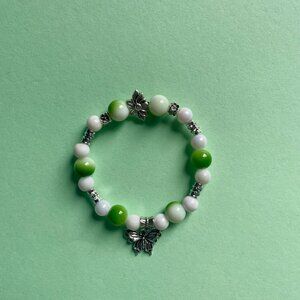Handmade bracelet with beads and dangling butterfly charm